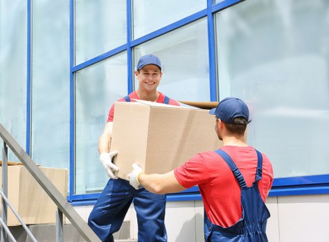 Professional movers handling office equipment during a Barnet relocation