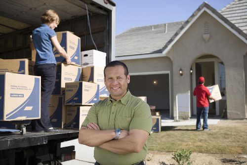 Movers carrying boxes during a fast Barnet relocation