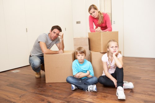 Boxes and household items being organized into storage in Barnet