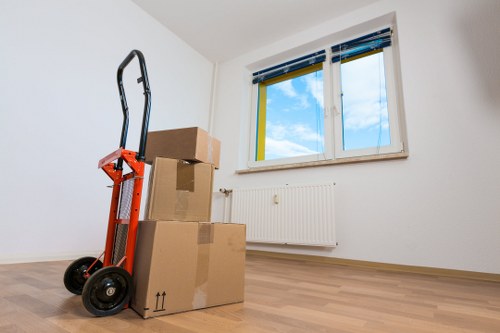 Professional movers loading boxes into a van in Barnet